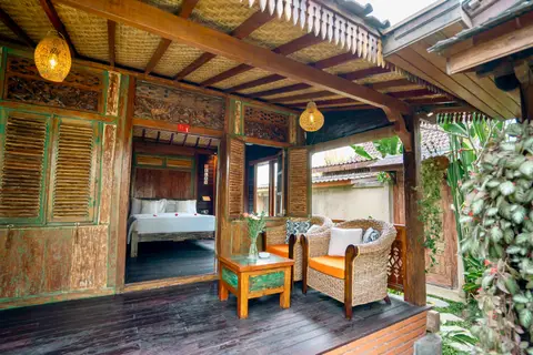 Rumah Elfi: first bedroom with carved wooden doors