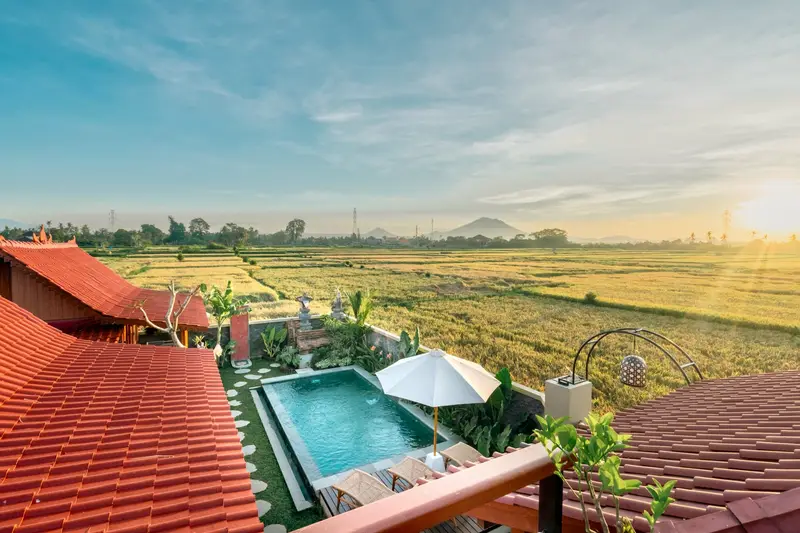 Joglo Hati: view from upstairs over the pool and rice fields